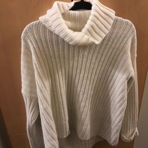 Cream cowl neck sweater.